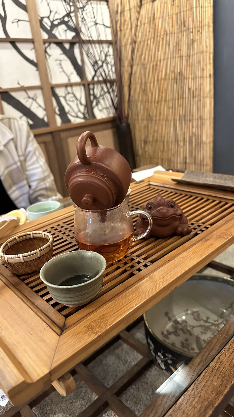 Clay teapot brewing red tea